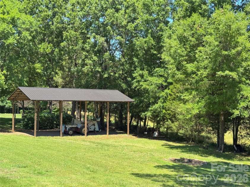 132 Monarch Lane, Mooresville, NC 28115.  MLS# CAR4391250, YatesRealty ID 35878. Fire Pit and Target Practice Area Near Pole Barn