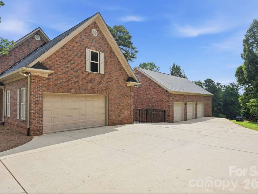 132 Monarch Lane, Mooresville, NC 28115.  MLS# CAR4391250, YatesRealty ID 35878. Plenty of Driveway and Garage Space for Car Enthusiasts
