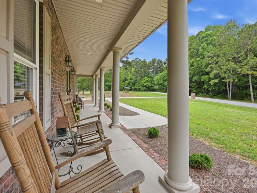 132 Monarch Lane, Mooresville, NC 28115.  MLS# CAR4391250, YatesRealty ID 35878. Rocking Chair Wrap-Around Front Porch