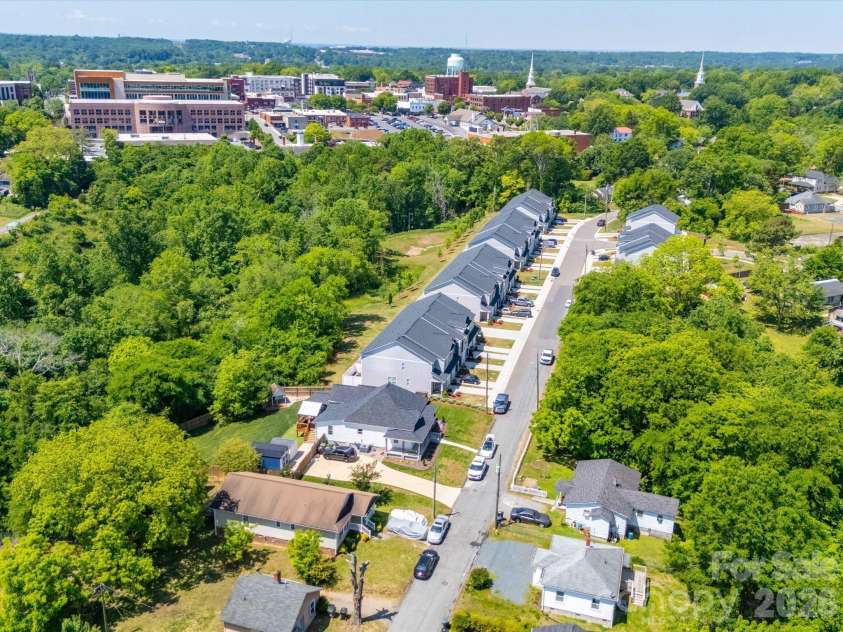 83 Woodsdale Place, Concord, NC 28025.  MLS# CAR4337022, YatesRealty ID 3590. View of Street showing Downtown Concord