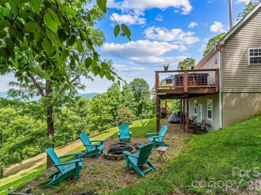 70 Heslar Way, Marshall, NC 28753.  MLS# CAR4388058, YatesRealty ID 35900. Beautiful fire pit off the rear deck