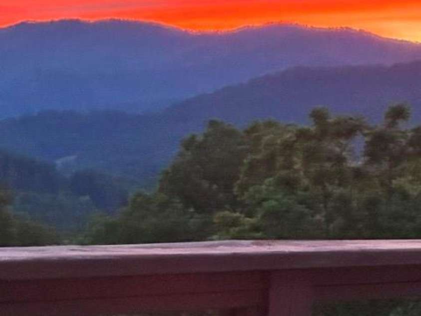 70 Heslar Way, Marshall, NC 28753.  MLS# CAR4388058, YatesRealty ID 35900. Sunset over the mountains that are right  off the back deck