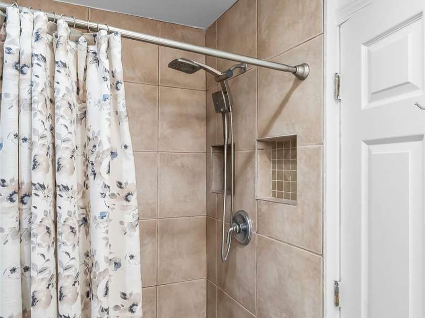 70 Heslar Way, Marshall, NC 28753.  MLS# CAR4388058, YatesRealty ID 35900. Walk in shower upper level
