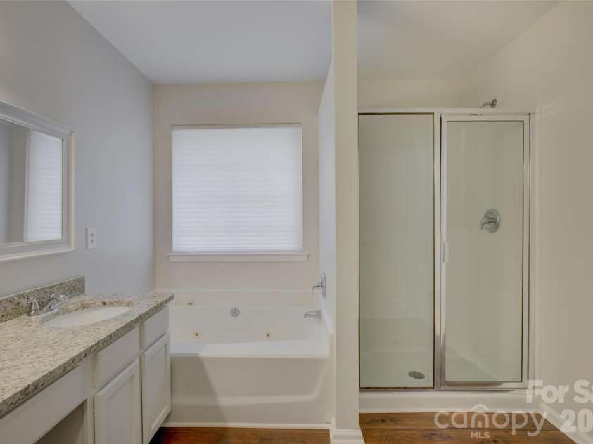 118 Creekside Drive, Fort Mill, SC 29715.  MLS# CAR4393993, YatesRealty ID 35903. Primary Bath - jetted tub and corner shower with glass door.