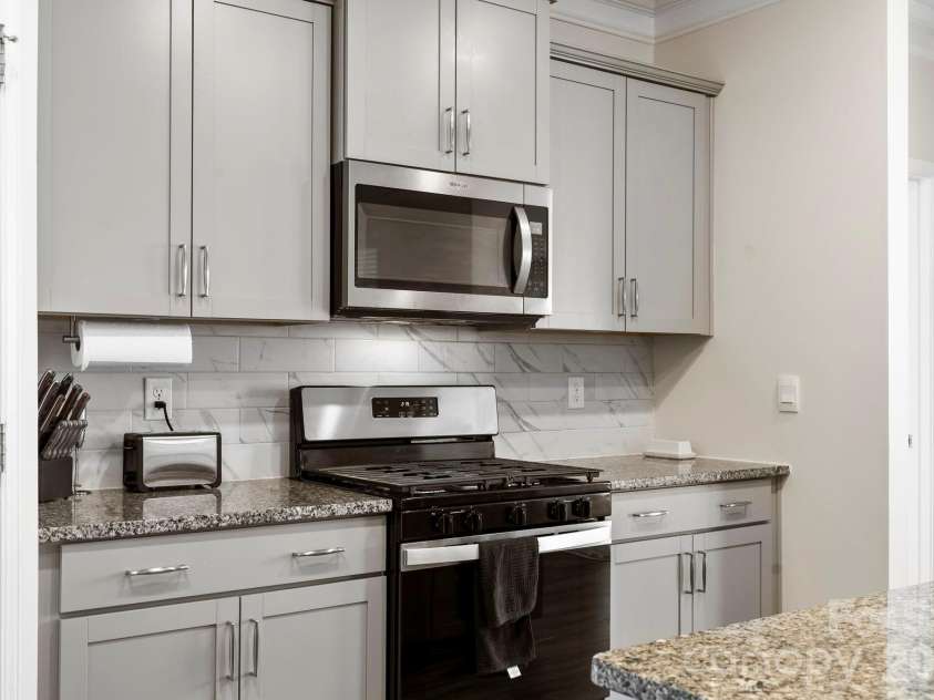 48 Thornberry Road, Hendersonville, NC 28792.  MLS# CAR4390884, YatesRealty ID 35905. Modern kitchen with SS appliance's