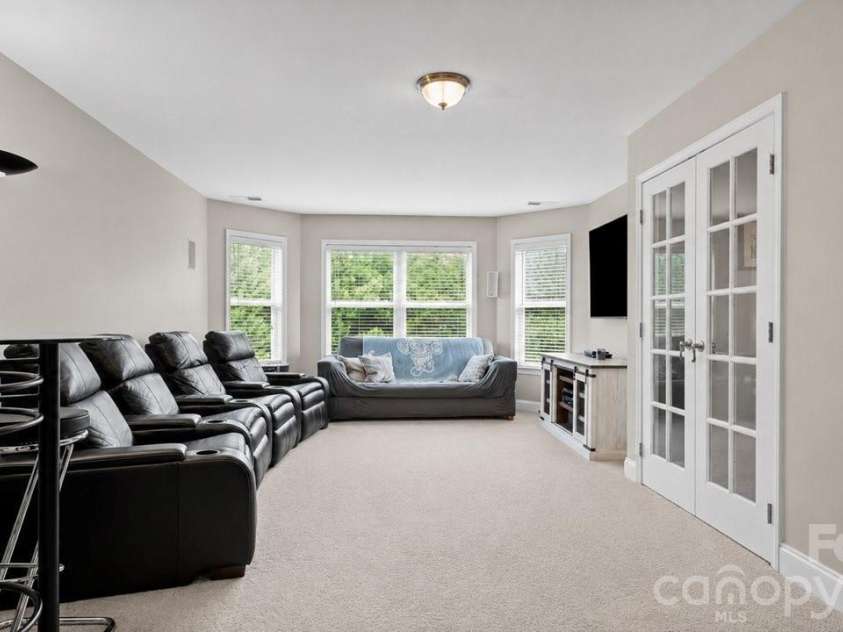 10209 Treetop Lane, Cornelius, NC 28031.  MLS# CAR4387634, YatesRealty ID 35909. Third floor media room with bathroom