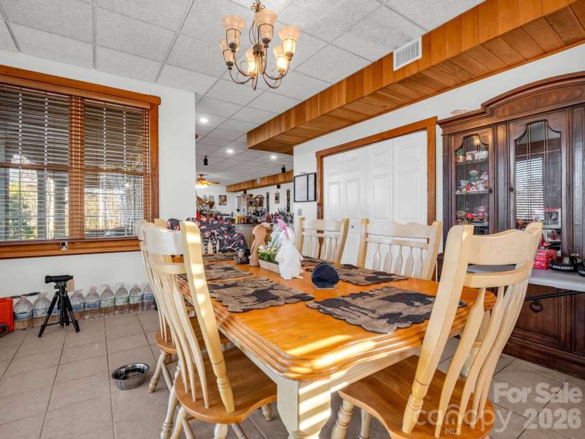 261 Boland Drive, Lake Lure, NC 28746.  MLS# CAR4232429, YatesRealty ID 3592. Finished Basement Dining Area