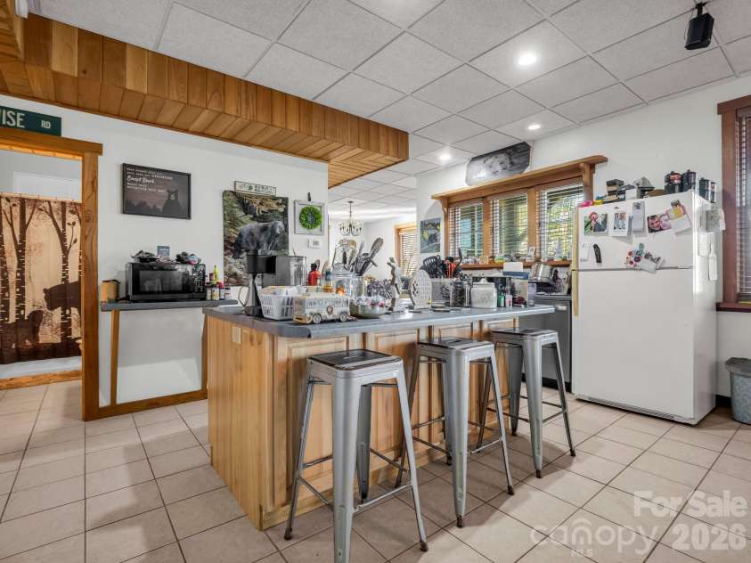 261 Boland Drive, Lake Lure, NC 28746.  MLS# CAR4232429, YatesRealty ID 3592. Finished Basement Kitchen with Island