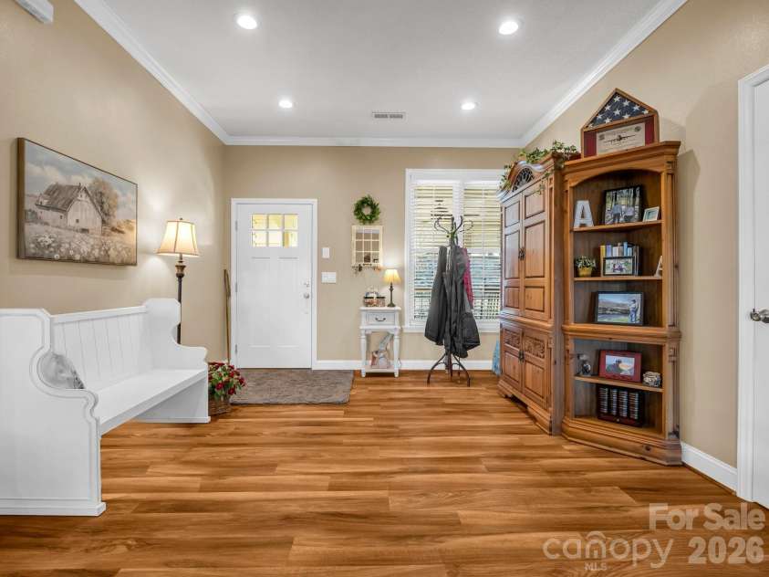 261 Boland Drive, Lake Lure, NC 28746.  MLS# CAR4232429, YatesRealty ID 3592. Home entry - stairs could be added to the  right to connect the finished basement 