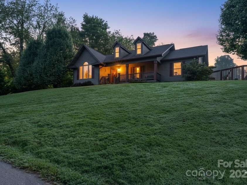 57 Stillwater Springs Road, Burnsville, NC 28714.  MLS# CAR4295423, YatesRealty ID 35954. Twilight 57 Stillwater Springs Road Burnsville, NC