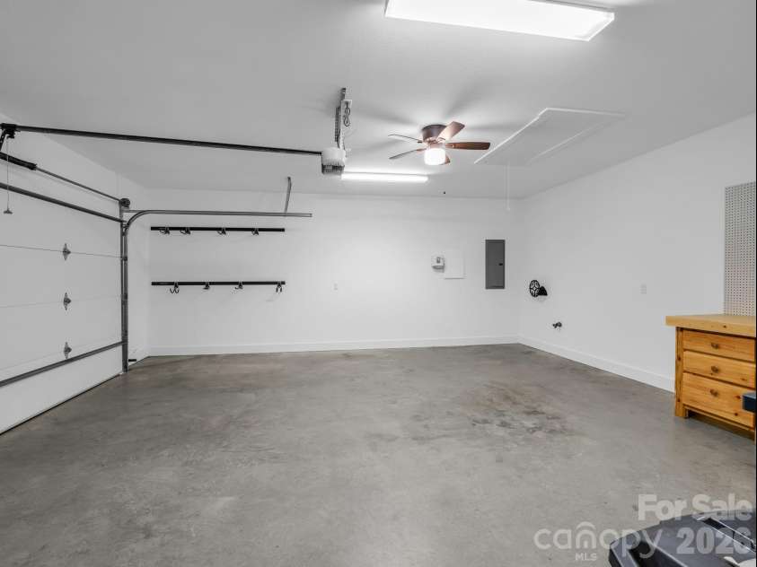 595 Summerfield Place, Flat Rock, NC 28731.  MLS# CAR4402478, YatesRealty ID 35964. Garage with attic access