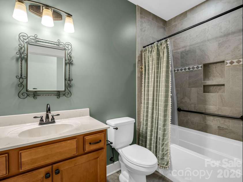595 Summerfield Place, Flat Rock, NC 28731.  MLS# CAR4402478, YatesRealty ID 35964. Hall bath with beautiful tile detail
