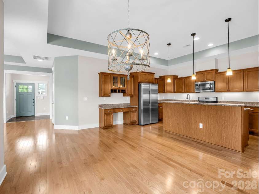 595 Summerfield Place, Flat Rock, NC 28731.  MLS# CAR4402478, YatesRealty ID 35964. Kitchen is open to the dining area