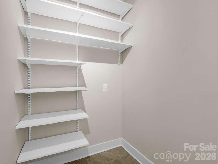 595 Summerfield Place, Flat Rock, NC 28731.  MLS# CAR4402478, YatesRealty ID 35964. Laundry room storage