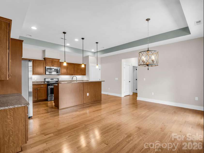 595 Summerfield Place, Flat Rock, NC 28731.  MLS# CAR4402478, YatesRealty ID 35964. Open airy kitchen/dining flows from living room