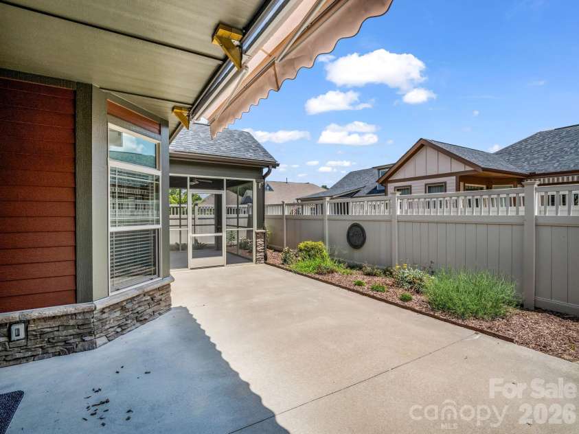 595 Summerfield Place, Flat Rock, NC 28731.  MLS# CAR4402478, YatesRealty ID 35964. Patio with retractable awning