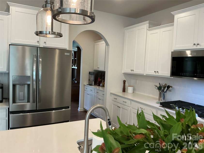 199 Hamptons Cove Road, Troutman, NC 28166.  MLS# CAR4398943, YatesRealty ID 35974. Butler's pantry provides so much extra storage