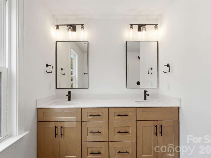 116 7th Avenue, Hickory, NC 28602.  MLS# CAR4400544, YatesRealty ID 35983. Dual Sinks & Mirrors in the Primary Bathroom