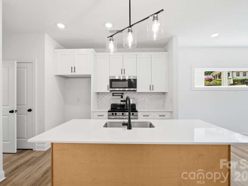 116 7th Avenue, Hickory, NC 28602.  MLS# CAR4400544, YatesRealty ID 35983. View of Kitchen with Kitchen Island Breakfast Bar