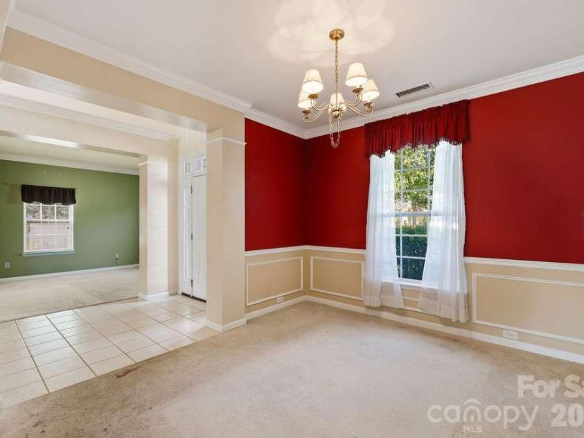 7424 Hannah Alexander Lane, Charlotte, NC 28227.  MLS# CAR4402040, YatesRealty ID 35986. Dining Room w/ Home office on other side of Foyer