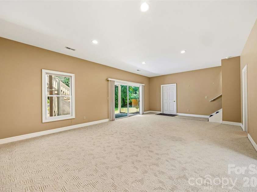 200 Teaberry Lane, Hendersonville, NC 28739.  MLS# CAR4399670, YatesRealty ID 36016. Finished Lower-Level Flex Space