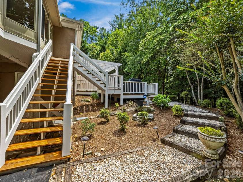 200 Teaberry Lane, Hendersonville, NC 28739.  MLS# CAR4399670, YatesRealty ID 36016. Rear Deck & Garden Path