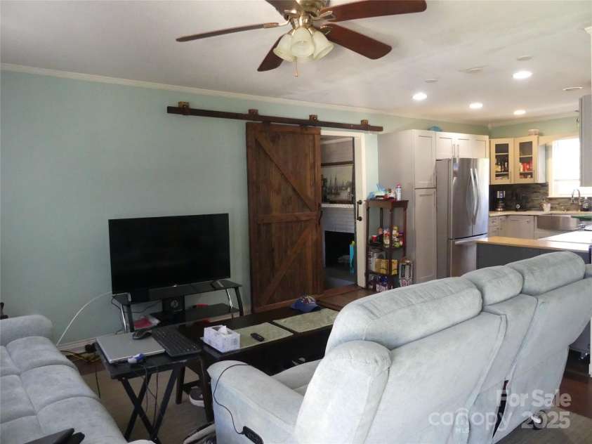 355 Swink Avenue, Salisbury, NC 28147.  MLS# CAR4314538, YatesRealty ID 3602. Barndoor goes to den.