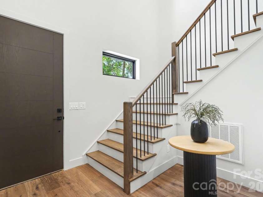 850 Belmont Avenue, Charlotte, NC 28205.  MLS# CAR4362751, YatesRealty ID 36021. Custom-made open staircase