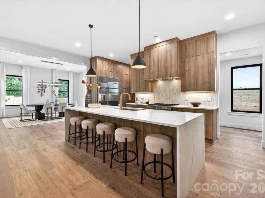 850 Belmont Avenue, Charlotte, NC 28205.  MLS# CAR4362751, YatesRealty ID 36021. Oversized waterfall kitchen island