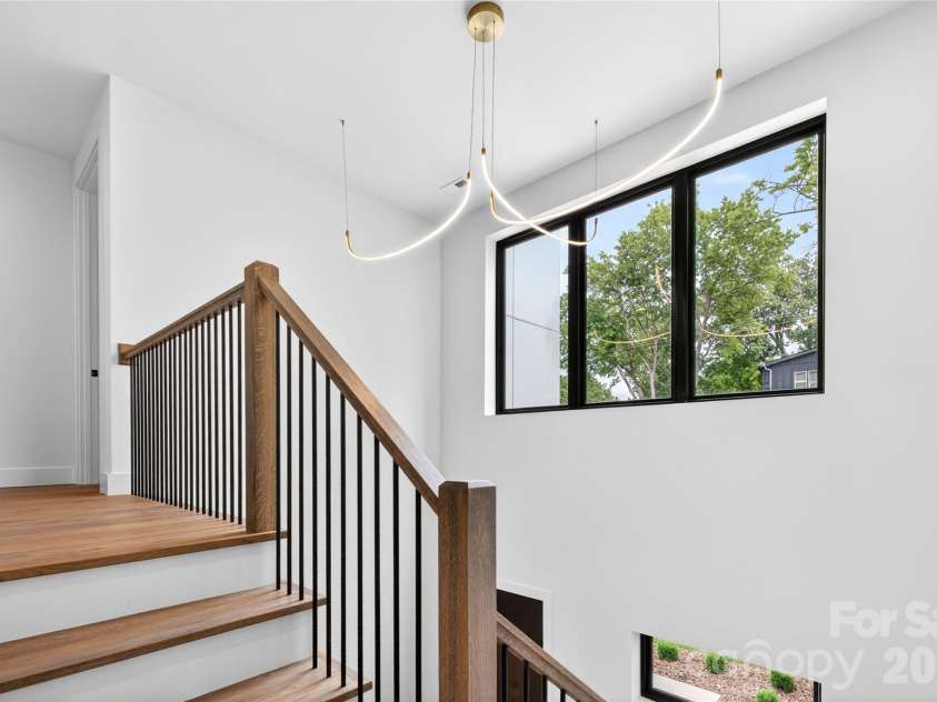 850 Belmont Avenue, Charlotte, NC 28205.  MLS# CAR4362751, YatesRealty ID 36021. Second Floor Staircase Entry