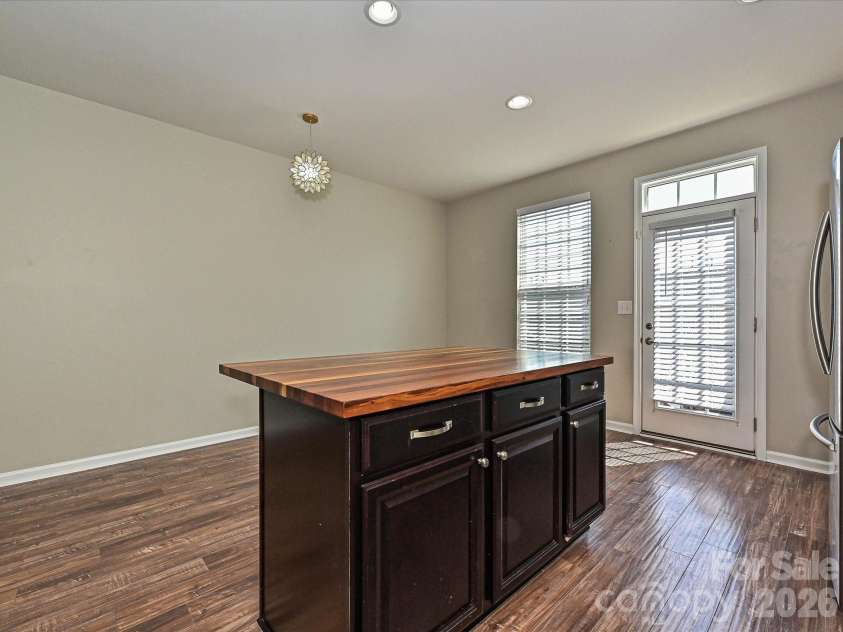 19791 Playwrights Way, Cornelius, NC 28031.  MLS# CAR4388972, YatesRealty ID 36024. Kitchen and Dining Area with LVP Flooring