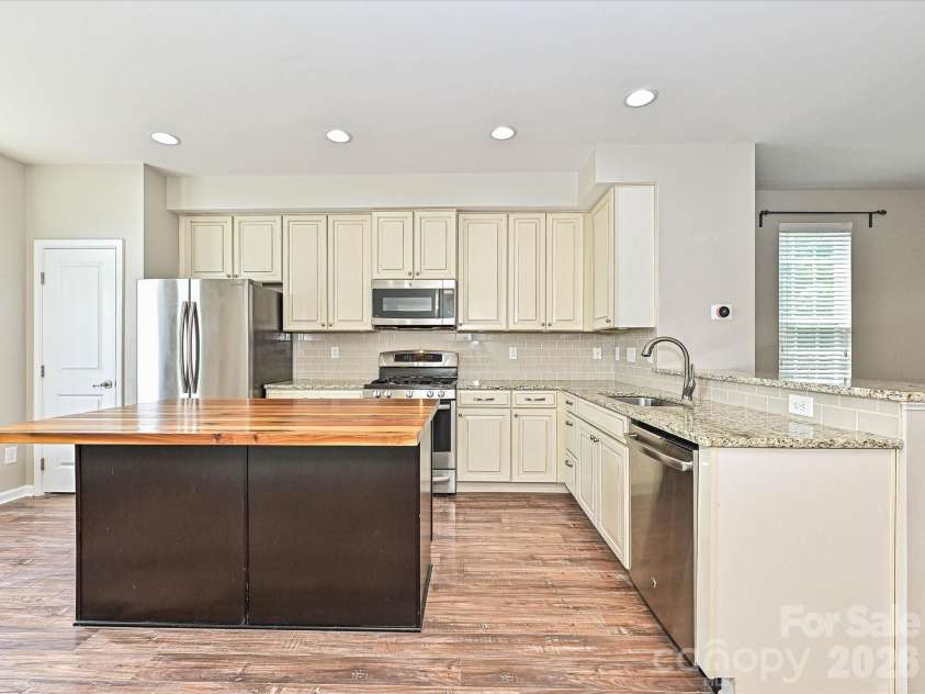 19791 Playwrights Way, Cornelius, NC 28031.  MLS# CAR4388972, YatesRealty ID 36024. Kitchen with Upgraded Cabinets