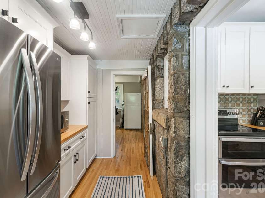 25 Saint Dunstans Circle, Asheville, NC 28803.  MLS# CAR4400820, YatesRealty ID 36032. Additional kitchen space with exposed stone