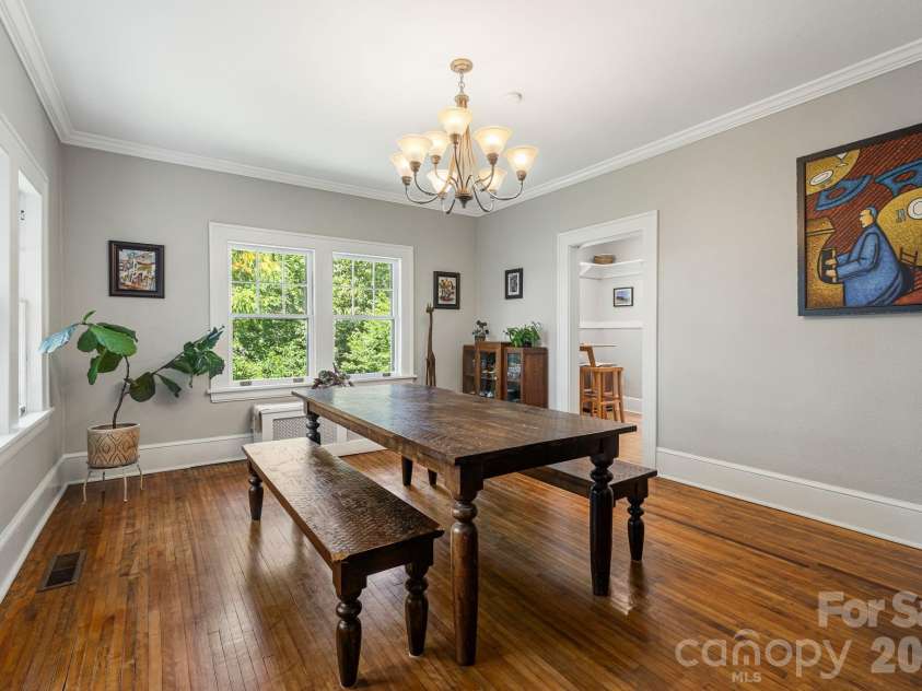 25 Saint Dunstans Circle, Asheville, NC 28803.  MLS# CAR4400820, YatesRealty ID 36032. Formal dining room looking into the kitchen breakfast nook