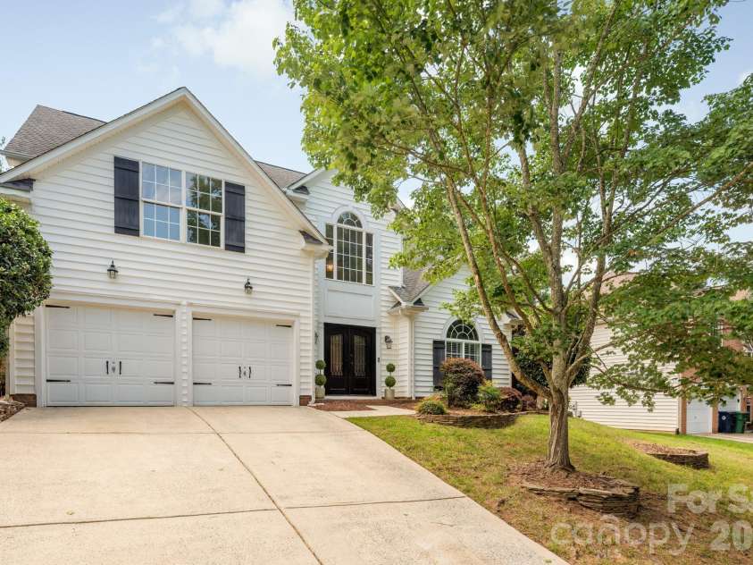 20307 Southshore Drive, Cornelius, NC 28031.  MLS# CAR4395285, YatesRealty ID 36036. 2 car garage and entrance with grand metal doors
