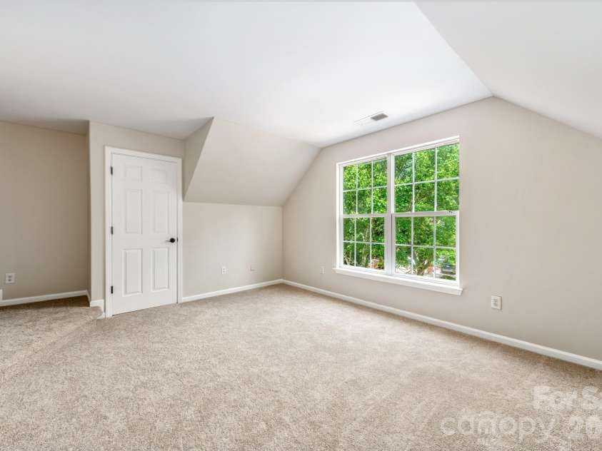 20307 Southshore Drive, Cornelius, NC 28031.  MLS# CAR4395285, YatesRealty ID 36036. Front bedroom