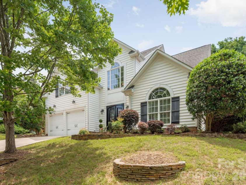 20307 Southshore Drive, Cornelius, NC 28031.  MLS# CAR4395285, YatesRealty ID 36036. Front of home with metal doors