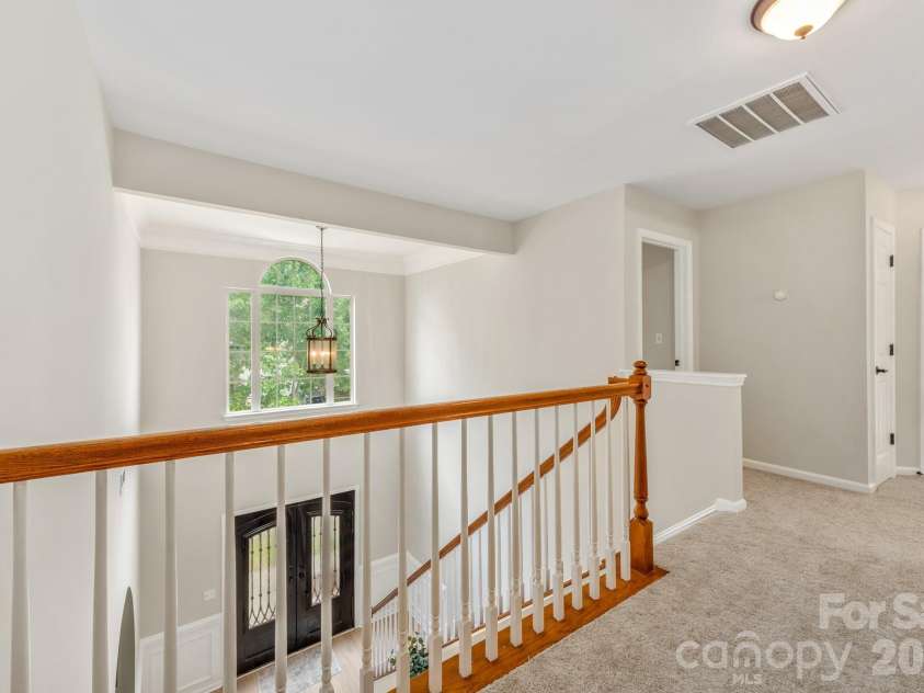 20307 Southshore Drive, Cornelius, NC 28031.  MLS# CAR4395285, YatesRealty ID 36036. Upstairs hallway overlooking the