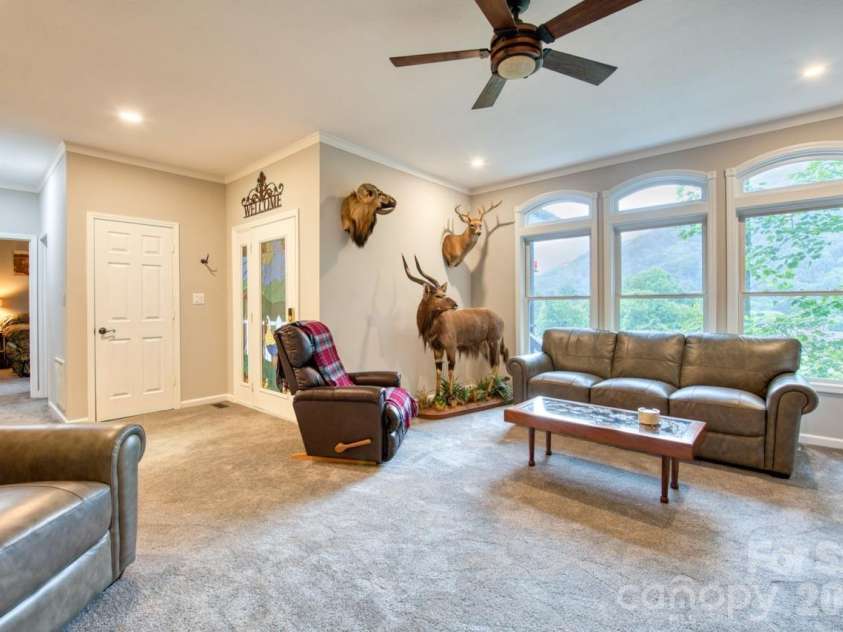7 Higel Lane, Maggie Valley, NC 28751.  MLS# CAR4400794, YatesRealty ID 36040. Arched windows give an open view to the valley below