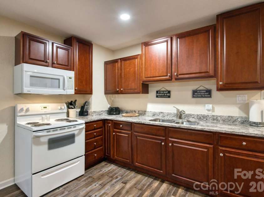 7 Higel Lane, Maggie Valley, NC 28751.  MLS# CAR4400794, YatesRealty ID 36040. Fully furnished lower kitchen