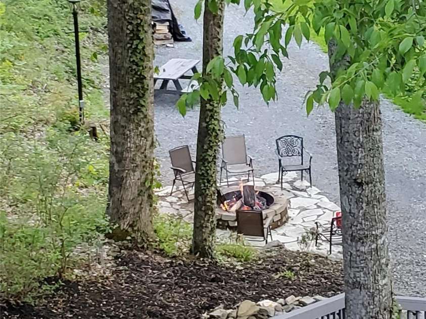 7 Higel Lane, Maggie Valley, NC 28751.  MLS# CAR4400794, YatesRealty ID 36040. Steps to fire pit and adjacent lot