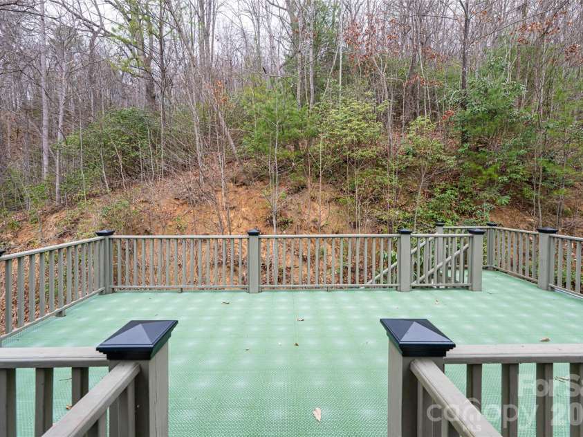 31 Timber Park Drive, Black Mountain, NC 28711.  MLS# CAR4336754, YatesRealty ID 3605. Deck over car port virtually staged