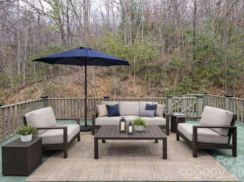 31 Timber Park Drive, Black Mountain, NC 28711.  MLS# CAR4336754, YatesRealty ID 3605. Deck over car port virtually staged