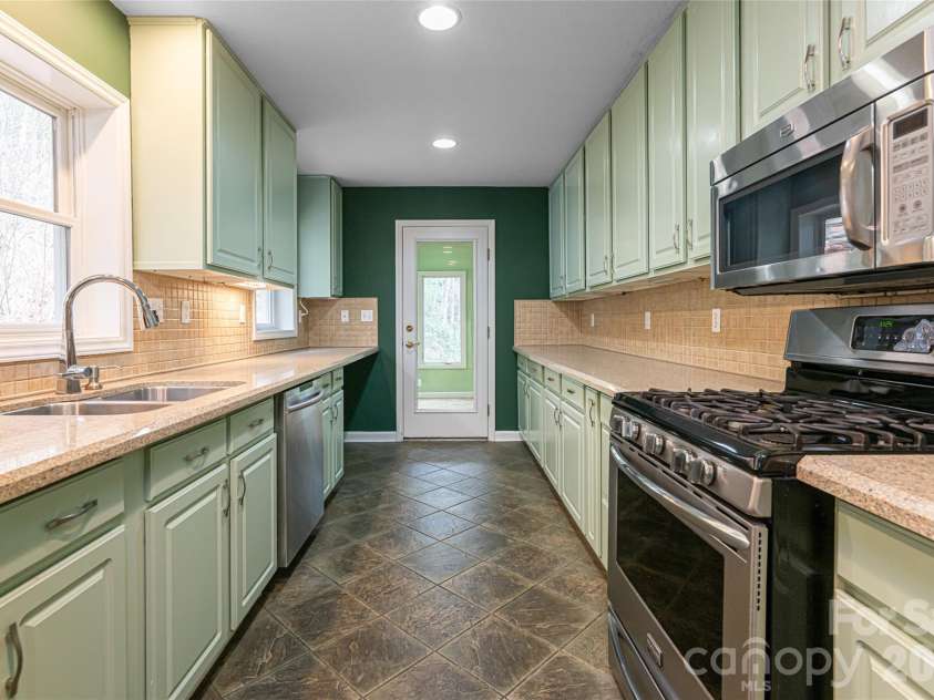 31 Timber Park Drive, Black Mountain, NC 28711.  MLS# CAR4336754, YatesRealty ID 3605. Kitchen view looking towards breakfast area