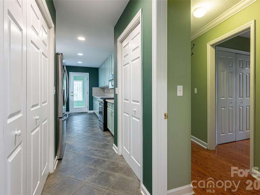 31 Timber Park Drive, Black Mountain, NC 28711.  MLS# CAR4336754, YatesRealty ID 3605. Main level laundry and pantry.
