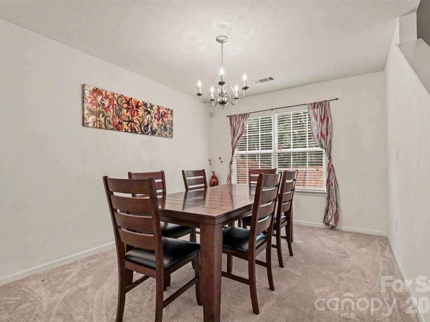 9424 Quilting Bee Lane, Charlotte, NC 28216.  MLS# CAR4393973, YatesRealty ID 36051. Full dining room. Accomodates larger table.