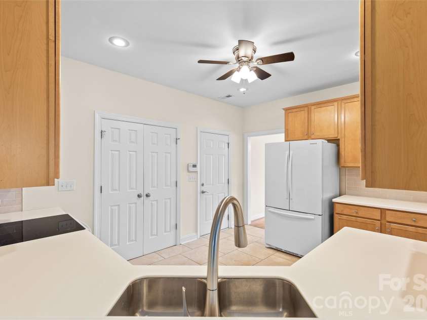 1017 Curry Way, Matthews, NC 28104.  MLS# CAR4402195, YatesRealty ID 36064. Garage entry leads into kitchen, wired for security system