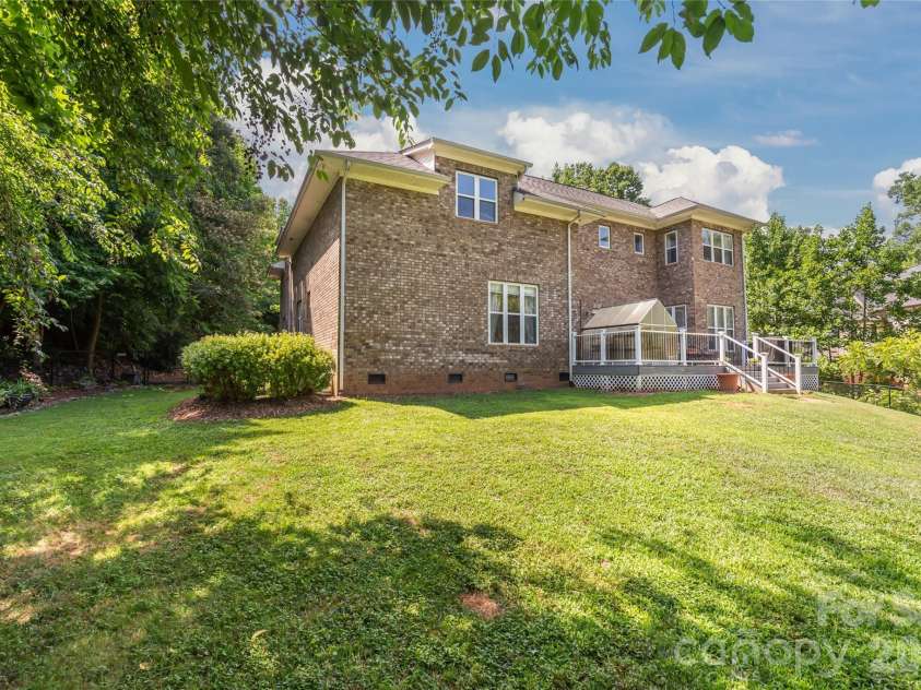 7365 Gabriel Street, Sherrills Ford, NC 28673.  MLS# CAR4391409, YatesRealty ID 36076. Large backyard with mature trees