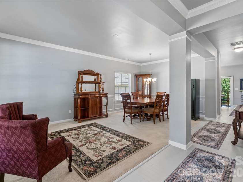 4831 Turnridge Court, Concord, NC 28027.  MLS# CAR4396977, YatesRealty ID 36078. Warm sitting area opens to formal dining area