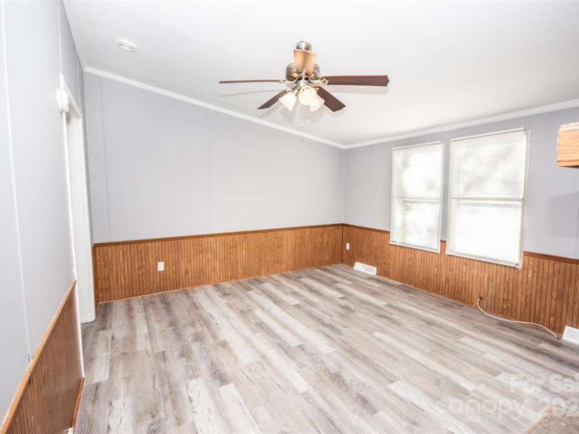 943 Tabor Road, Olin, NC 28660.  MLS# CAR4319811, YatesRealty ID 3609. Cozy Den with fireplace!